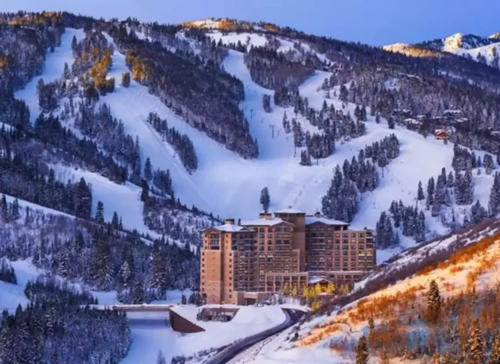 St. Regis Deer Valley sits at the base of a snow-covered mountain system in Park City, Utah