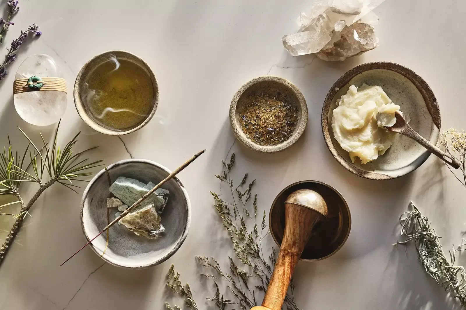 Aesthetic picture, looking from above, of several spa elements, like vases and Crystals, with decorative foliage