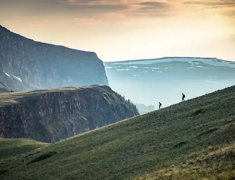 Steamboat Springs distant view of two people hiking down the mountain
