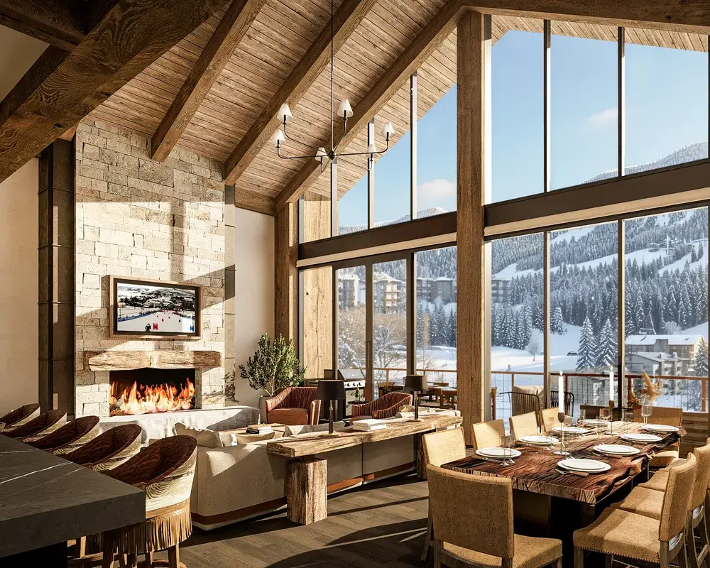 Stockman Interior view of the Barn Great Room Living Room area with a nine seats dinning table, living room sofa and fireplace, next to a tall bar with chairs and scenic window in the background